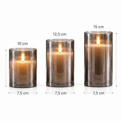 Infographie présentant les dimensions des trois bougies LED rechargeables en verre fumé. Les trois formats affichent un diamètre de 7,5 cm avec des hauteurs de 10 cm, 12,5 cm et 15 cm. Illustration idéale pour comparer les tailles et choisir la bougie décorative adaptée à une table, une console, un salon ou une chambre tout en créant une ambiance chaleureuse et élégante.
