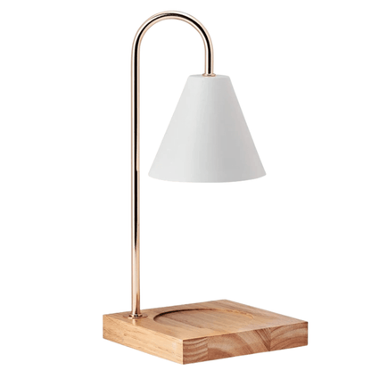 Lampe chauffe-bougie aromathérapie premium blanche avec structure métallique dorée et base en bois naturel. Design élégant et minimaliste conçu pour faire fondre les bougies parfumées sans flamme et diffuser leurs fragrances en douceur dans la maison